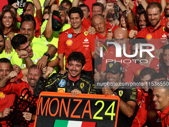 Charles Leclerc, Carlos Sainz of Ferrari and Frederic Vasseur celebrate with the team after the Formula 1 Italian Grand Prix at Autodromo Na...