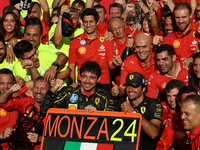 Charles Leclerc, Carlos Sainz of Ferrari and Frederic Vasseur celebrate with the team after the Formula 1 Italian Grand Prix at Autodromo Na...