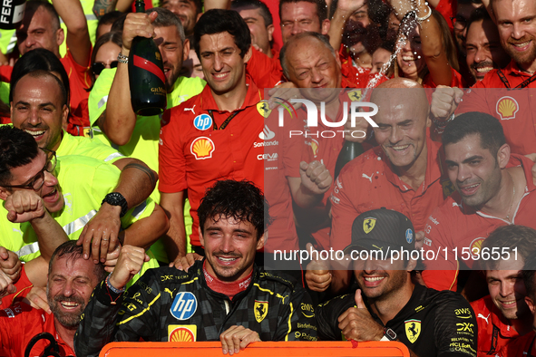 Charles Leclerc, Carlos Sainz of Ferrari and Frederic Vasseur celebrate with the team after the Formula 1 Italian Grand Prix at Autodromo Na...