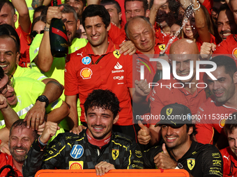 Charles Leclerc, Carlos Sainz of Ferrari and Frederic Vasseur celebrate with the team after the Formula 1 Italian Grand Prix at Autodromo Na...