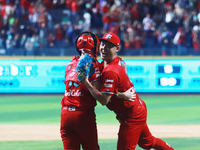 Patrick Mazeika #12 and Tomohiro Anraku #20 of Diablos Rojos celebrate after match 6 of the Mexican Baseball League (LMB) South Zone 2024 ch...