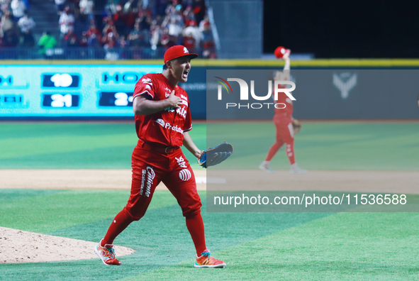 Tomohiro Anraku #20 of Diablos Rojos celebrates after match 6 of the Mexican Baseball League (LMB) South Zone 2024 championship series again...