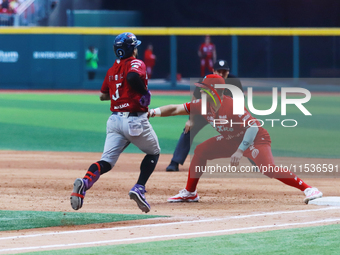 Jose Marmolejos #46 of Diablos Rojos tags Jorge Flores #3 of Guerreros de Oaxaca during match 6 of the Mexican Baseball League (LMB) South Z...