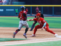 Jose Marmolejos #46 of Diablos Rojos tags Jorge Flores #3 of Guerreros de Oaxaca during match 6 of the Mexican Baseball League (LMB) South Z...