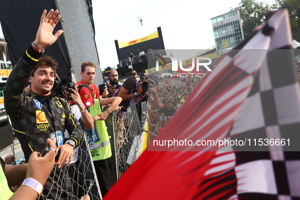 Charles Leclerc of Ferrari ceelbrates with fans after the Formula 1 Italian Grand Prix at Autodromo Nazionale di Monza in Monza, Italy on Se...