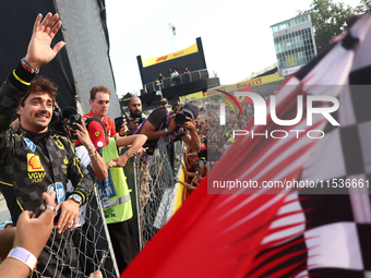 Charles Leclerc of Ferrari ceelbrates with fans after the Formula 1 Italian Grand Prix at Autodromo Nazionale di Monza in Monza, Italy on Se...