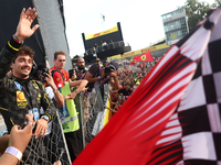 Charles Leclerc of Ferrari ceelbrates with fans after the Formula 1 Italian Grand Prix at Autodromo Nazionale di Monza in Monza, Italy on Se...