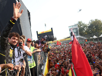 Charles Leclerc of Ferrari ceelbrates with fans after the Formula 1 Italian Grand Prix at Autodromo Nazionale di Monza in Monza, Italy on Se...