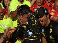 Charles Leclerc and Carlos Sainz of Ferrari celebrate with the team after the Formula 1 Italian Grand Prix at Autodromo Nazionale di Monza i...