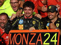 Charles Leclerc and Carlos Sainz of Ferrari celebrate with the team after the Formula 1 Italian Grand Prix at Autodromo Nazionale di Monza i...