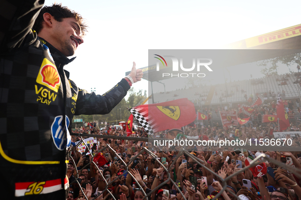 Charles Leclerc of Ferrari ceelbrates with fans after the Formula 1 Italian Grand Prix at Autodromo Nazionale di Monza in Monza, Italy on Se...