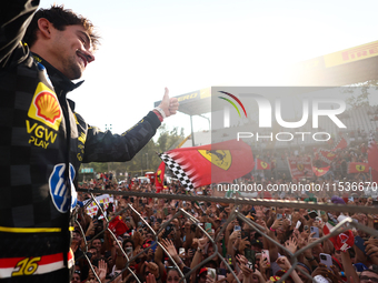 Charles Leclerc of Ferrari ceelbrates with fans after the Formula 1 Italian Grand Prix at Autodromo Nazionale di Monza in Monza, Italy on Se...