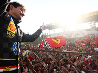 Charles Leclerc of Ferrari ceelbrates with fans after the Formula 1 Italian Grand Prix at Autodromo Nazionale di Monza in Monza, Italy on Se...