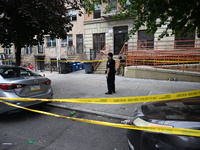 A police officer guards the crime scene. A 37-year-old male is shot and killed in Brooklyn, New York, United States, on September 1, 2024. A...