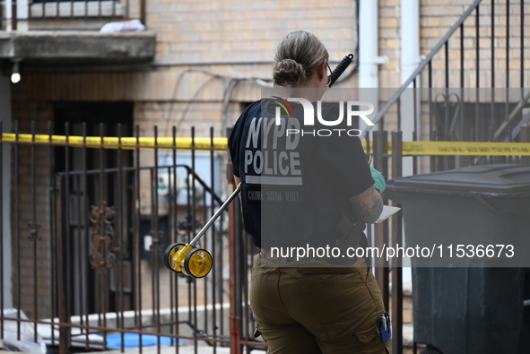 A New York City Police Department crime scene unit officer is at the scene. A 37-year-old male is shot and killed in Brooklyn, New York, Uni...