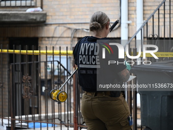 A New York City Police Department crime scene unit officer is at the scene. A 37-year-old male is shot and killed in Brooklyn, New York, Uni...