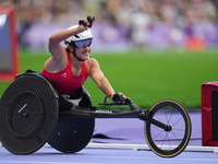 Catherine Debrunner of Switzerland celebrates winning gold in Women's 800m - T53 Final during the Paris 2024 Paralympic Games at Stade de Fr...