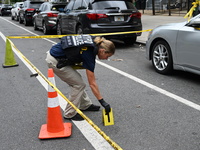 Shell casing is recovered at the crime scene and an evidence marker is placed. A 37-year-old male is shot and killed in Brooklyn, New York,...