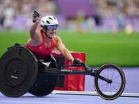 Catherine Debrunner of Switzerland celebrates winning gold in Women's 800m - T53 Final during the Paris 2024 Paralympic Games at Stade de Fr...