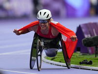 Catherine Debrunner of Switzerland celebrates winning gold in Women's 800m - T53 Final during the Paris 2024 Paralympic Games at Stade de Fr...