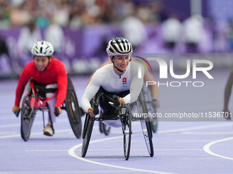 Manuela Schaer of Switzerland celebrates winning gold in Women's 800m - T54 Final during the Paris 2024 Paralympic Games at Stade de France...