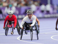 Manuela Schaer of Switzerland celebrates winning gold in Women's 800m - T54 Final during the Paris 2024 Paralympic Games at Stade de France...