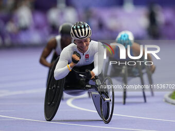 Manuela Schaer of Switzerland celebrates winning gold in Women's 800m - T54 Final during the Paris 2024 Paralympic Games at Stade de France...