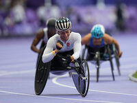 Manuela Schaer of Switzerland celebrates winning gold in Women's 800m - T54 Final during the Paris 2024 Paralympic Games at Stade de France...