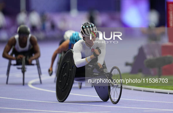 Manuela Schaer of Switzerland celebrates winning gold in Women's 800m - T54 Final during the Paris 2024 Paralympic Games at Stade de France...