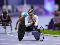 Manuela Schaer of Switzerland celebrates winning gold in Women's 800m - T54 Final during the Paris 2024 Paralympic Games at Stade de France...