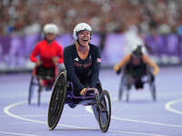 Hannah Cockroft of Great Britain celebrates winning gold in Women's 100m - T34 Final during the Paris 2024 Paralympic Games at Stade de Fran...