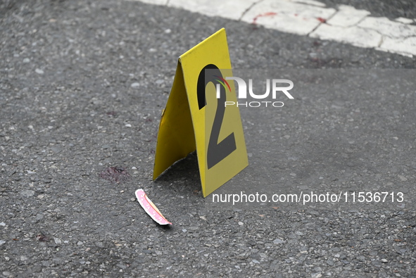 An evidence marker marks blood found at the crime scene. A 37-year-old male is shot and killed in Brooklyn, New York, United States, on Sept...