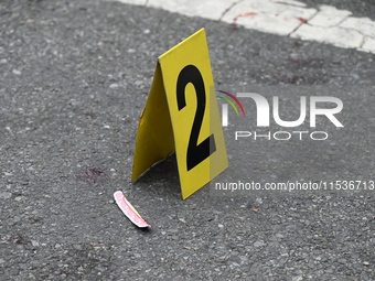 An evidence marker marks blood found at the crime scene. A 37-year-old male is shot and killed in Brooklyn, New York, United States, on Sept...