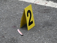 An evidence marker marks blood found at the crime scene. A 37-year-old male is shot and killed in Brooklyn, New York, United States, on Sept...