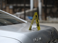 An evidence marker marks where a phone charger is found at the crime scene. A 37-year-old male is shot and killed in Brooklyn, New York, Uni...