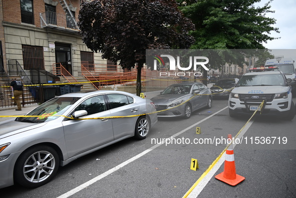 Evidence markers at the crime scene highlight where evidence is found. A 37-year-old male is shot and killed in Brooklyn, New York, United S...