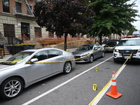 Evidence markers at the crime scene highlight where evidence is found. A 37-year-old male is shot and killed in Brooklyn, New York, United S...