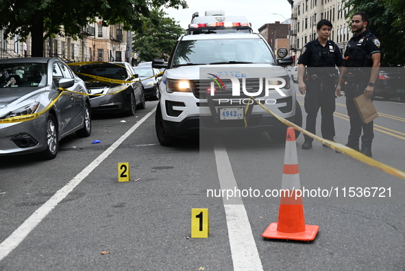 Evidence markers at the crime scene highlight where evidence is found. A 37-year-old male is shot and killed in Brooklyn, New York, United S...