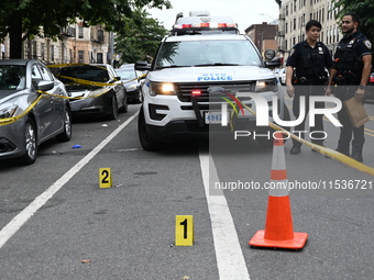 Evidence markers at the crime scene highlight where evidence is found. A 37-year-old male is shot and killed in Brooklyn, New York, United S...