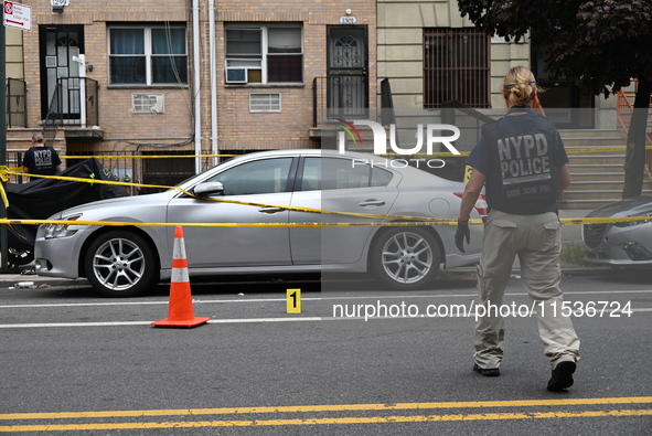 Evidence markers at the crime scene highlight where evidence is found. A 37-year-old male is shot and killed in Brooklyn, New York, United S...