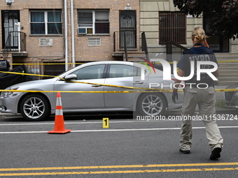 Evidence markers at the crime scene highlight where evidence is found. A 37-year-old male is shot and killed in Brooklyn, New York, United S...