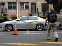 Evidence markers at the crime scene highlight where evidence is found. A 37-year-old male is shot and killed in Brooklyn, New York, United S...