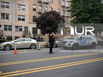 Evidence markers at the crime scene highlight where evidence is found. A 37-year-old male is shot and killed in Brooklyn, New York, United S...