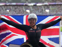 Hannah Cockroft of Great Britain celebrates winning gold in Women's 100m - T34 Final during the Paris 2024 Paralympic Games at Stade de Fran...