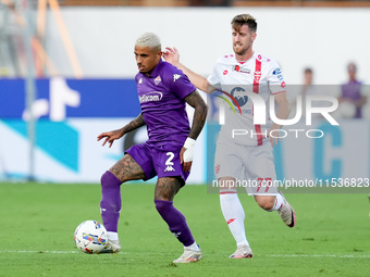 Dodo of ACF Fiorentina and Georgios Kyriakopoulos of AC Monza compete for the ball during the Serie A Enilive match between ACF Fiorentina a...