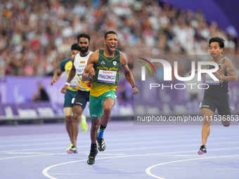 Mpumelelo Mhlongo of South Africa celebrates winning gold in Men's 100m - T44 Final during the Paris 2024 Paralympic Games at Stade de Franc...