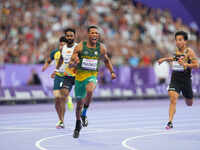 Mpumelelo Mhlongo of South Africa celebrates winning gold in Men's 100m - T44 Final during the Paris 2024 Paralympic Games at Stade de Franc...