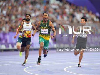 Mpumelelo Mhlongo of South Africa celebrates winning gold in Men's 100m - T44 Final during the Paris 2024 Paralympic Games at Stade de Franc...