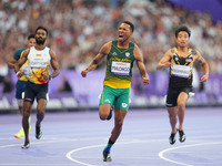 Mpumelelo Mhlongo of South Africa celebrates winning gold in Men's 100m - T44 Final during the Paris 2024 Paralympic Games at Stade de Franc...