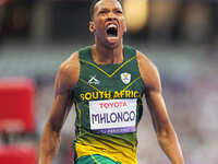 Mpumelelo Mhlongo of South Africa celebrates winning gold in Men's 100m - T44 Final during the Paris 2024 Paralympic Games at Stade de Franc...